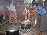 Larisula Women Cooking over Open Fire